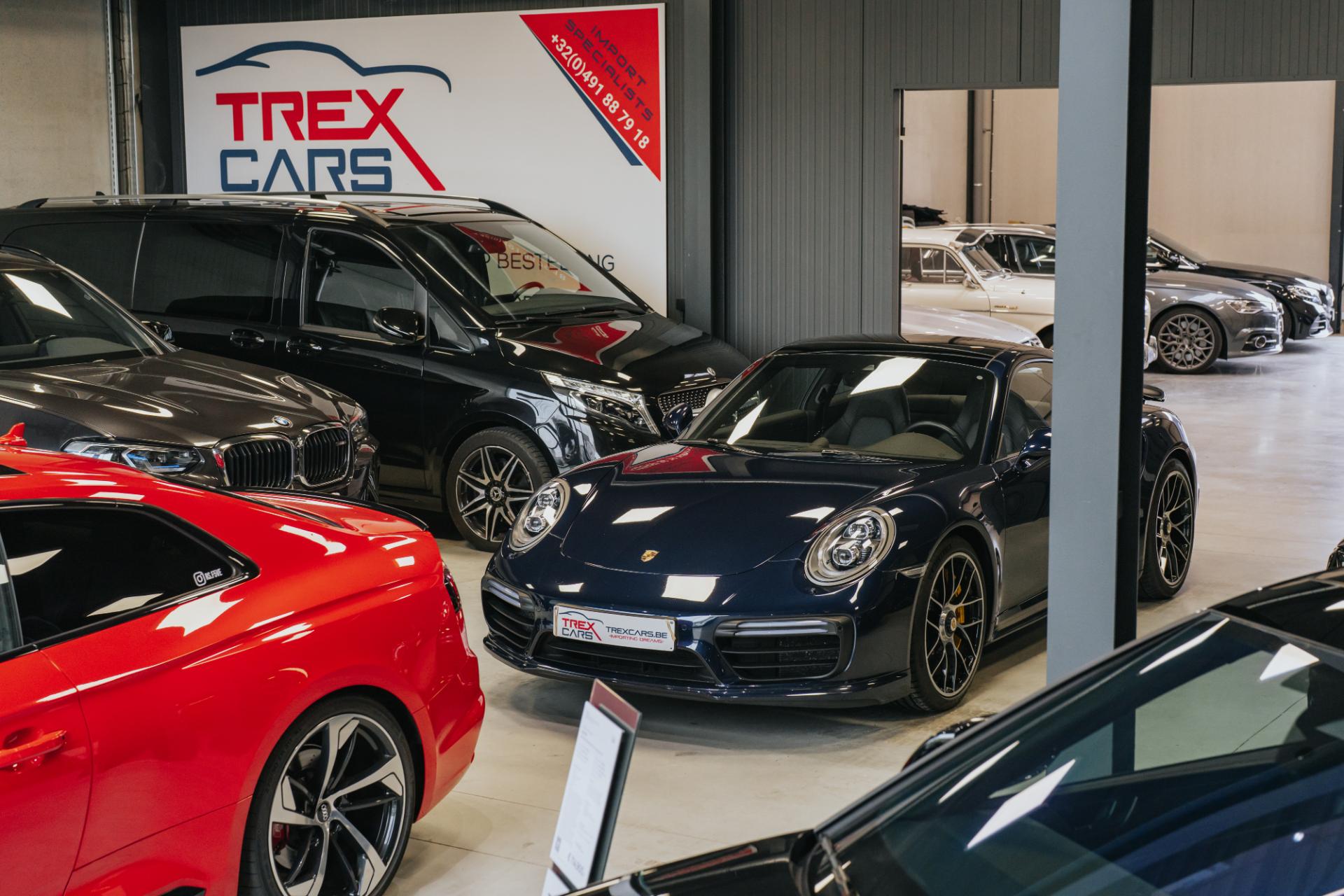 Porsche 911 in de showroom van Trex Cars, waar je je Porsche kan verkopen via consignatie